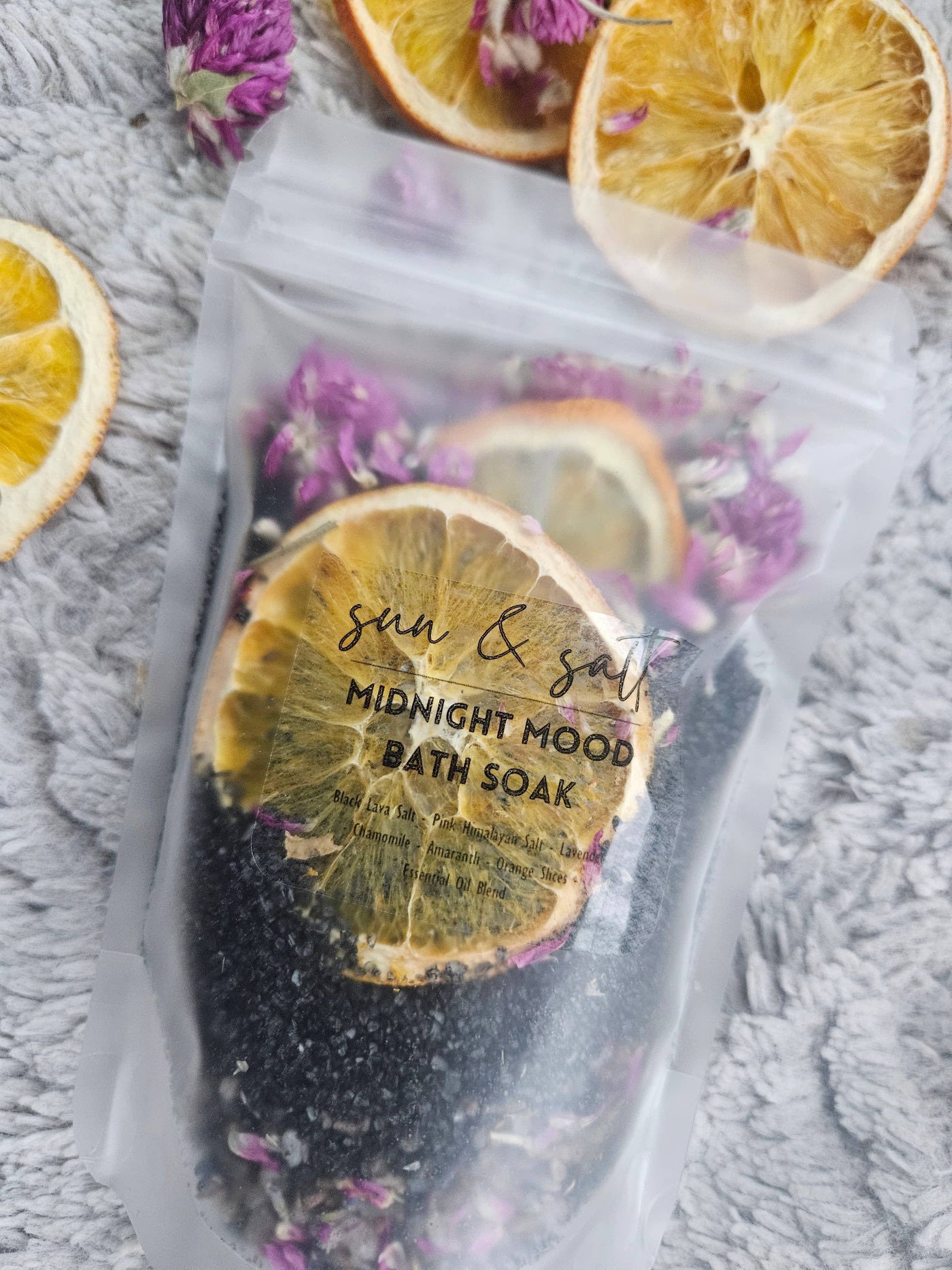 Treat your senses to the indulgent Midnight Mood bath soak.  Ingredient List: -Black Lava Salt&nbsp; - Pink Himalayan Salt - Chamomile - Lavender - Amaranth - Orange Slices - Essential Oil Blend&nbsp;  Handmade; Small Batch.  *2-3 Baths per bag.  Net. Wt. 6.5 oz.&nbsp;  These can be used in a sachet or loose. If used loose- allow tub to completely dry for easier clean-up.