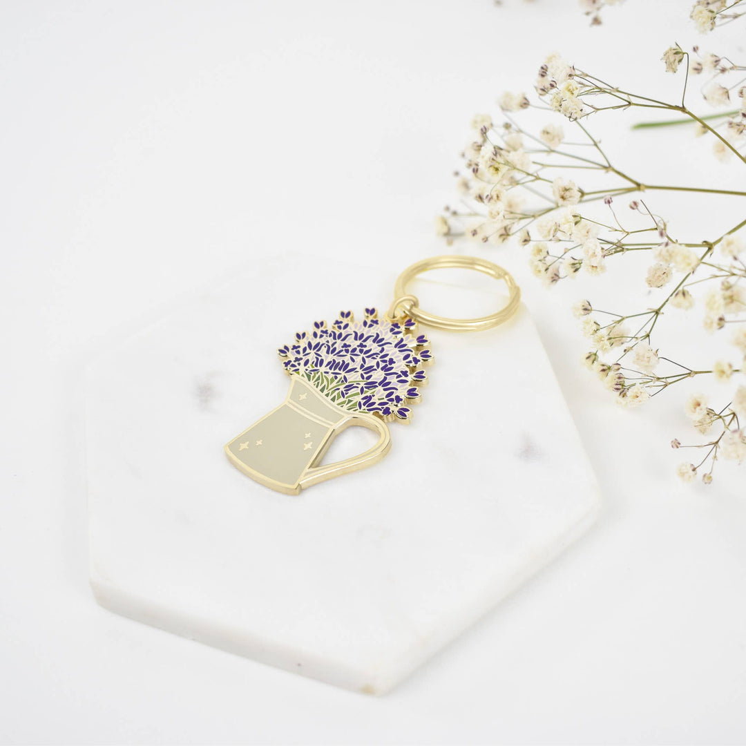 Hard enamel lavender pin. 2.5″ tall and 1.7″ wide with high polished gold base. Gold key ring attachment. Explore the best and coolest gift ideas for plant enthusiasts!