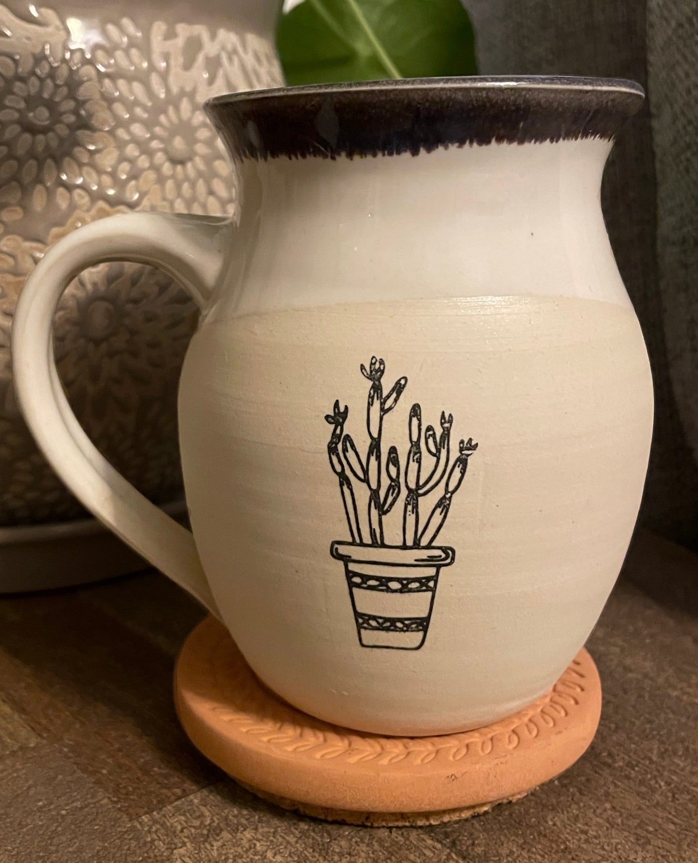 B3 These small batch, handmade mugs are available in blue or green. Each mug is stamped with a unique plant design. Explore the best and coolest gift ideas for plant enthusiasts!