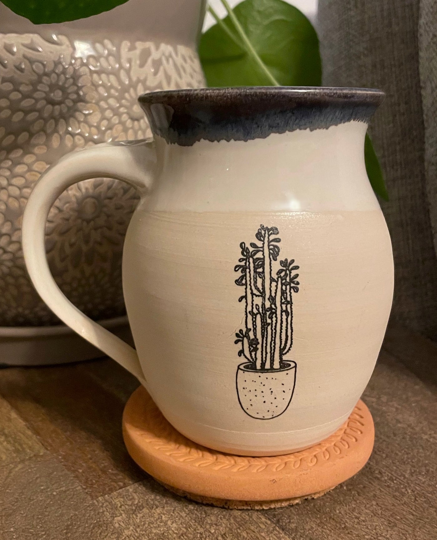 B4 These small batch, handmade mugs are available in blue or green. Each mug is stamped with a unique plant design. Explore the best and coolest gift ideas for plant enthusiasts!