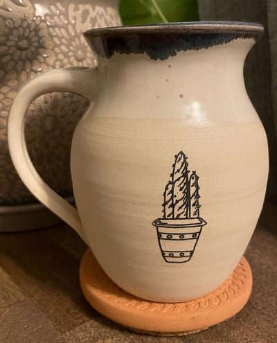 B6 These small batch, handmade mugs are available in blue or green. Each mug is stamped with a unique plant design. Explore the best and coolest gift ideas for plant enthusiasts!