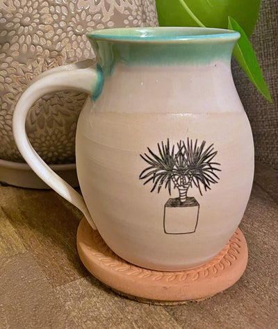 G1 These small batch, handmade mugs are available in blue or green. Each mug is stamped with a unique plant design. Explore the best and coolest gift ideas for plant enthusiasts!