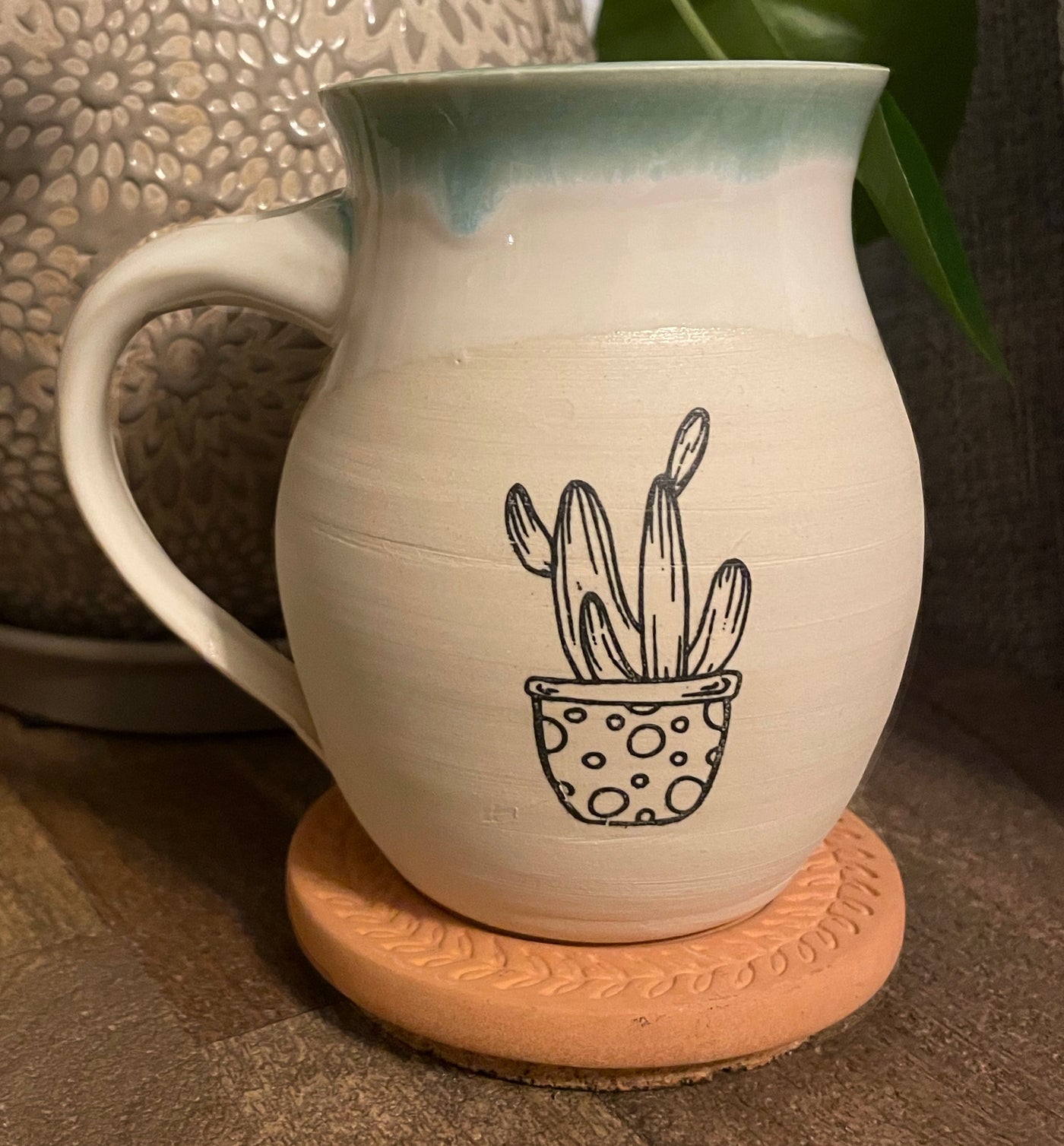 G5 These small batch, handmade mugs are available in blue or green. Each mug is stamped with a unique plant design. Explore the best and coolest gift ideas for plant enthusiasts!