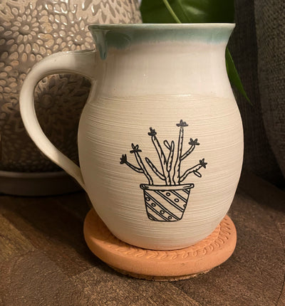 G3 These small batch, handmade mugs are available in blue or green. Each mug is stamped with a unique plant design. Explore the best and coolest gift ideas for plant enthusiasts!