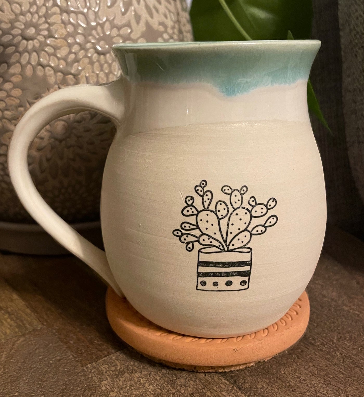 G4 These small batch, handmade mugs are available in blue or green. Each mug is stamped with a unique plant design. Explore the best and coolest gift ideas for plant enthusiasts!