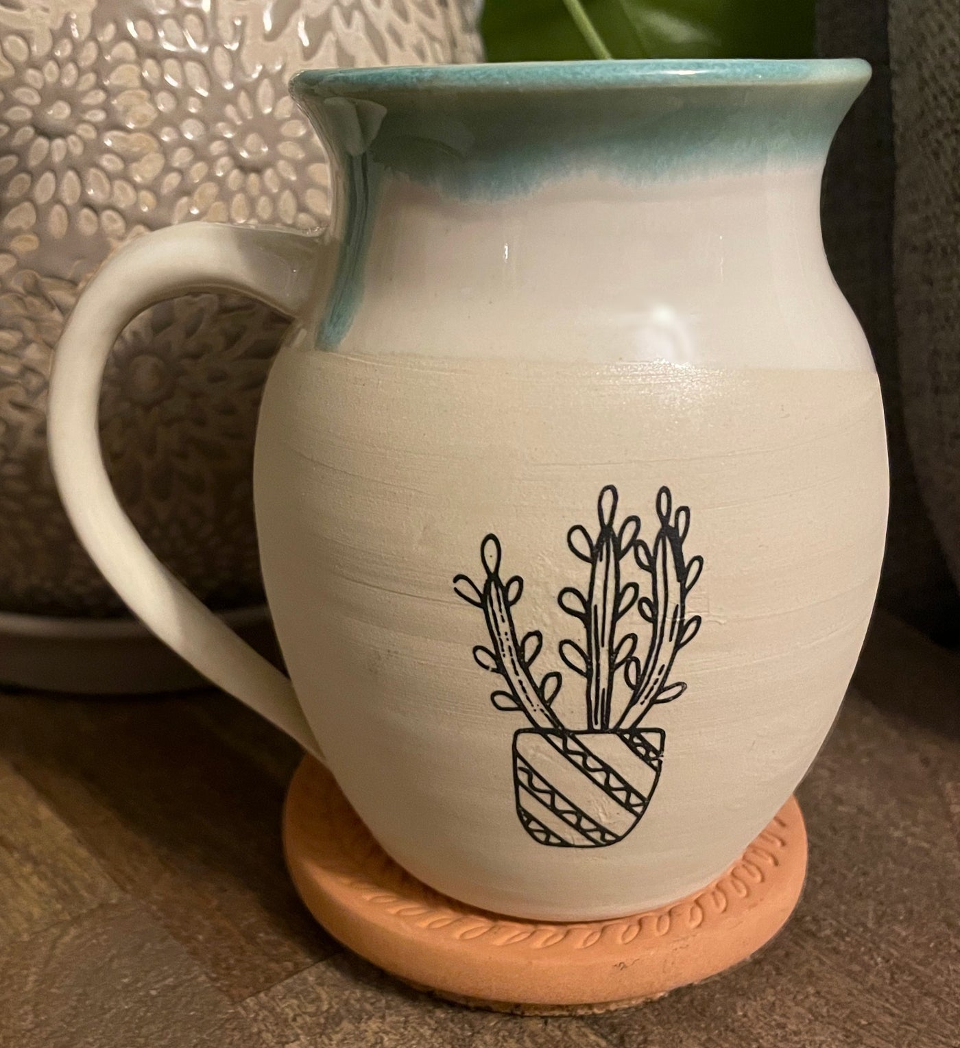 G7 These small batch, handmade mugs are available in blue or green. Each mug is stamped with a unique plant design. Explore the best and coolest gift ideas for plant enthusiasts!