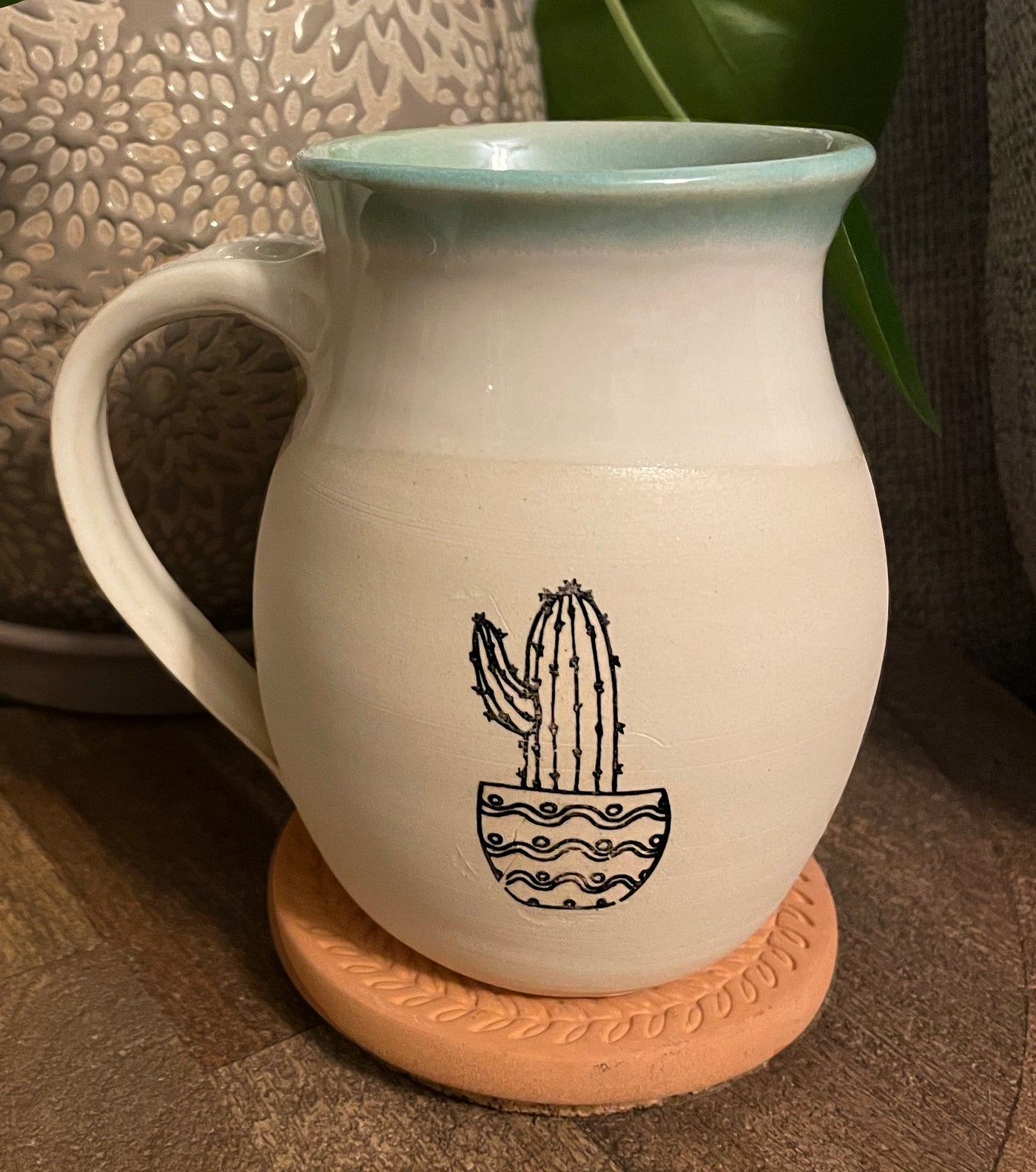 G8 These small batch, handmade mugs are available in blue or green. Each mug is stamped with a unique plant design. Explore the best and coolest gift ideas for plant enthusiasts!