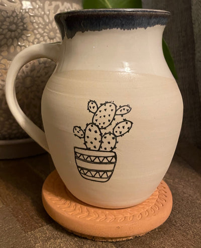 B1 These small batch, handmade mugs are available in blue or green. Each mug is stamped with a unique plant design. Explore the best and coolest gift ideas for plant enthusiasts!