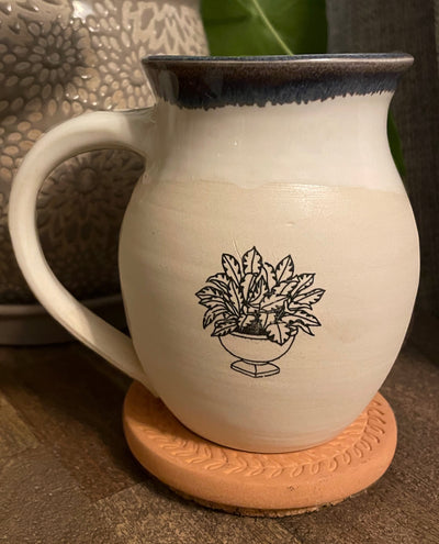 B2 These small batch, handmade mugs are available in blue or green. Each mug is stamped with a unique plant design. Explore the best and coolest gift ideas for plant enthusiasts!