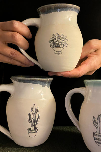 These small batch, handmade mugs are available in blue or green. Each mug is stamped with a unique plant design. Explore the best and coolest gift ideas for plant enthusiasts!